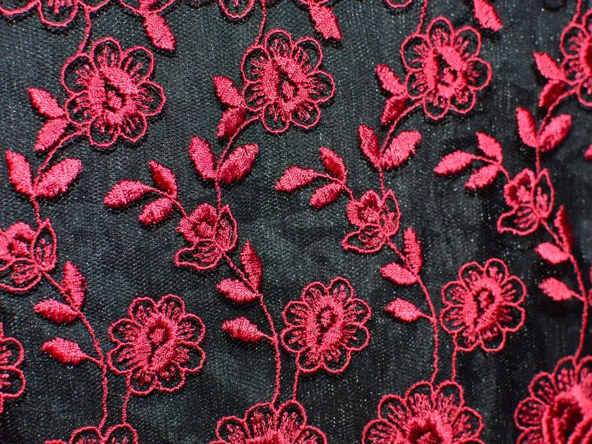 Elegant ladies dress with floral embroidery detailing by Fine Stitch Ajman