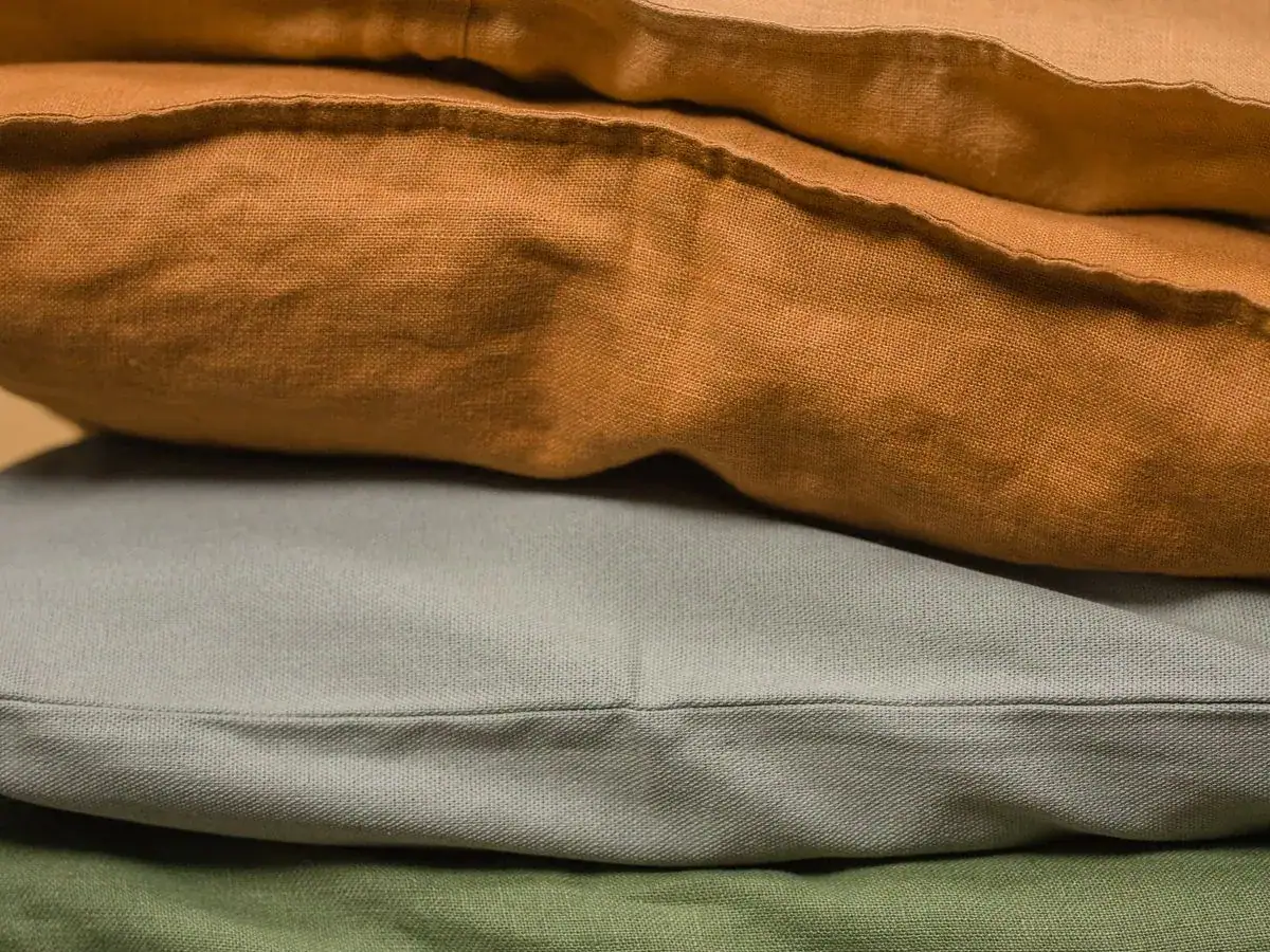 Embroidered hospitality linens and cushions by Fine Stitch Ajman